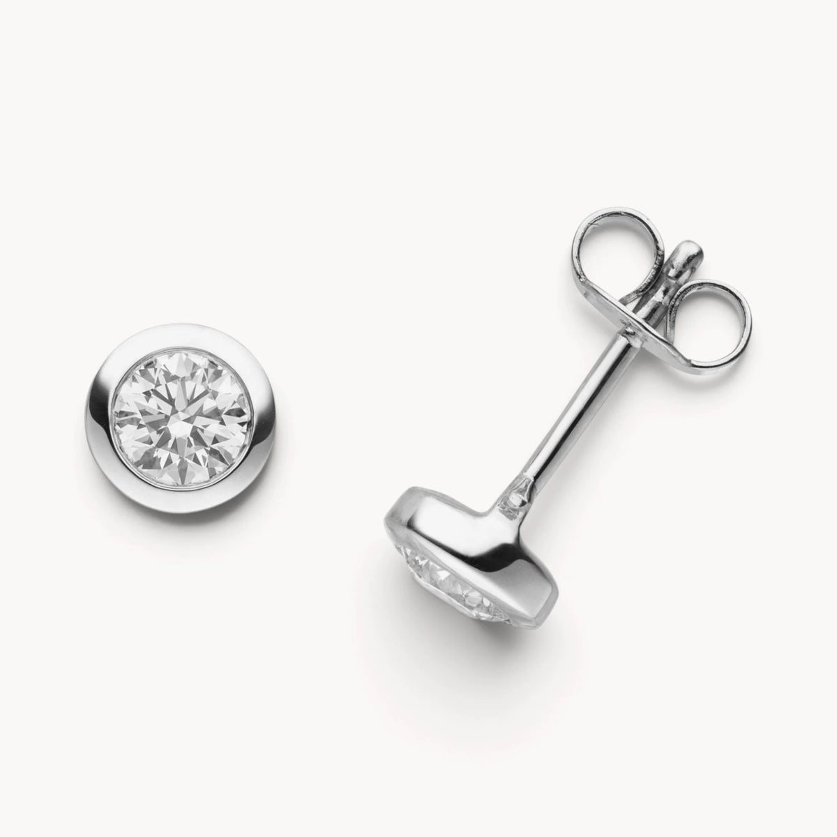 Ohrstecker in Gold & Platin mit Diamant, Zargenfassung