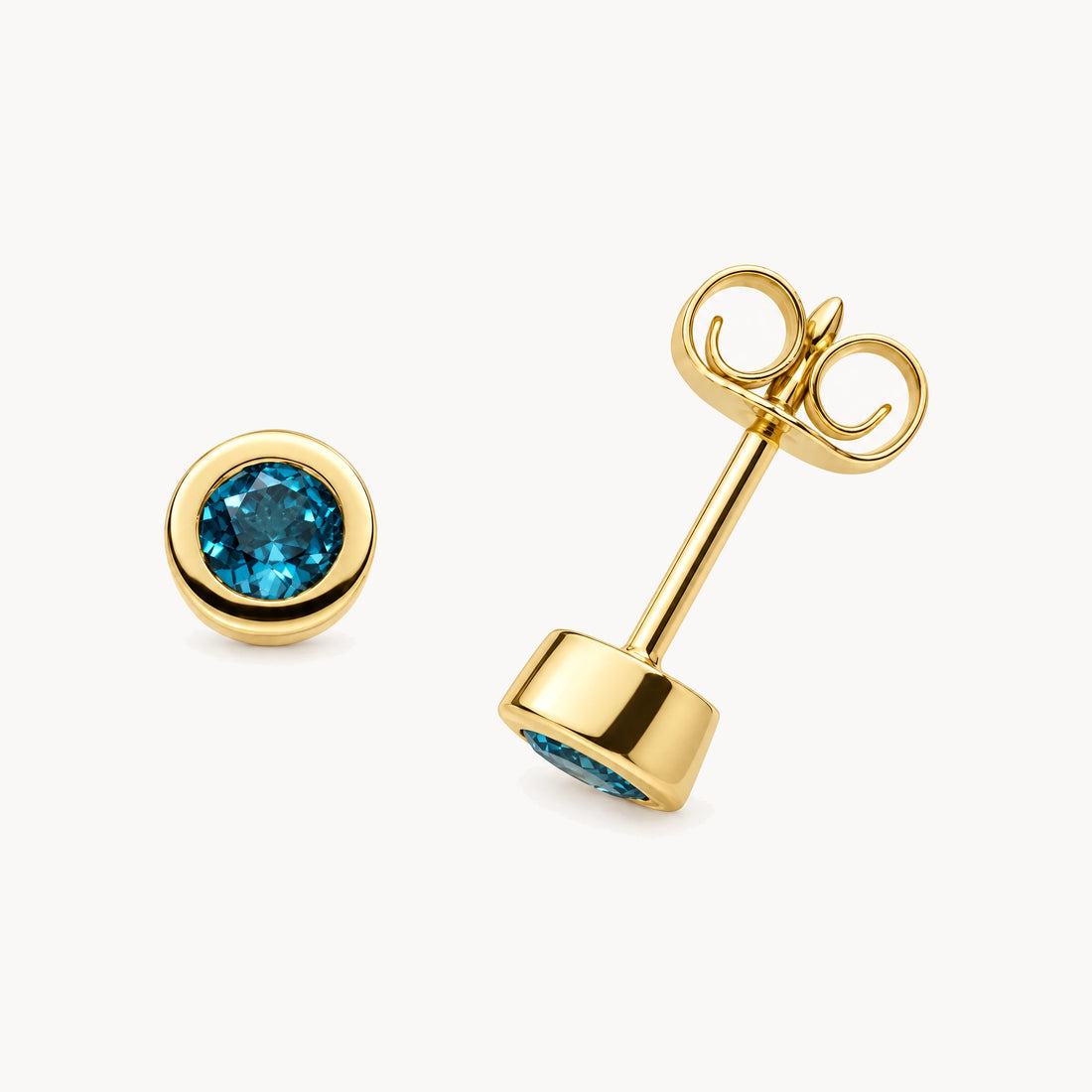 Ohrstecker in 333er Gelbgold mit Blautopas